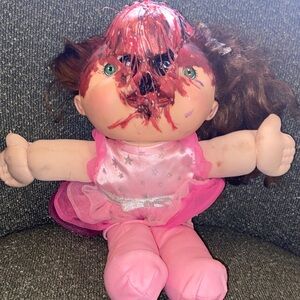 Halloween prop: cabbage Patch doll popping out their skull